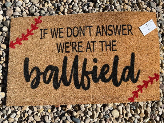 If We Don't Answer, We're At The Ball Field Doormat by Timber & Twine